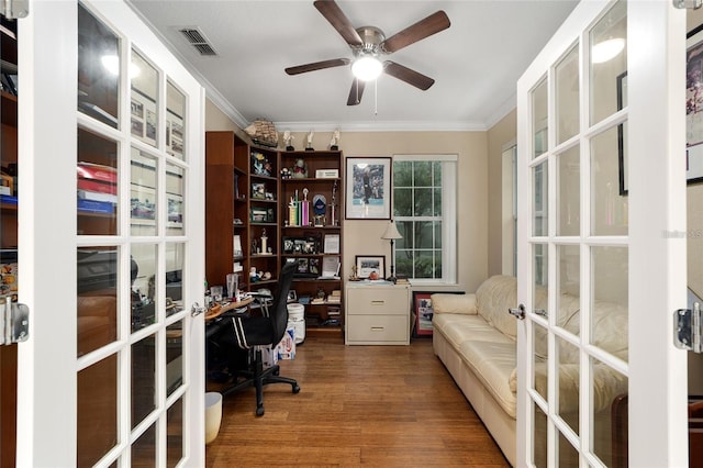 home office with hardwood / wood-style floors, ceiling fan, ornamental molding, and french doors