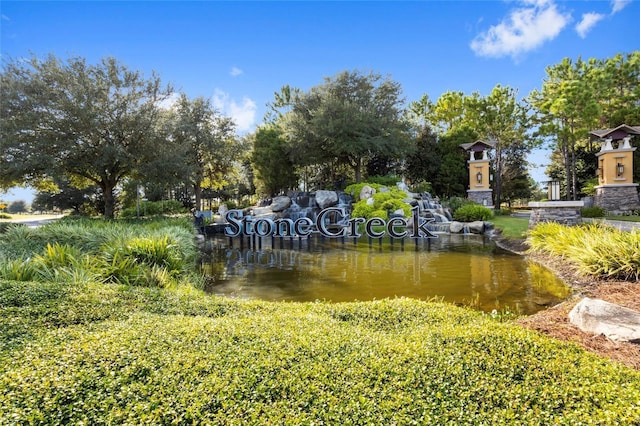 view of home's community with a water view