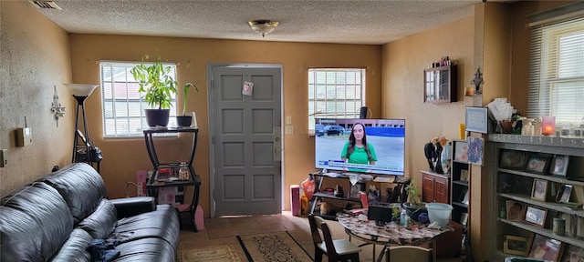 interior space featuring a textured ceiling