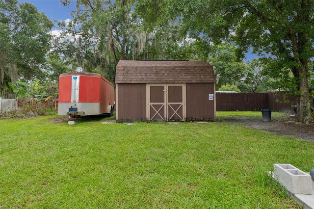 view of outdoor structure featuring a lawn