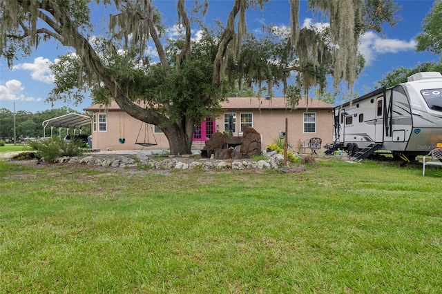 view of yard with a carport