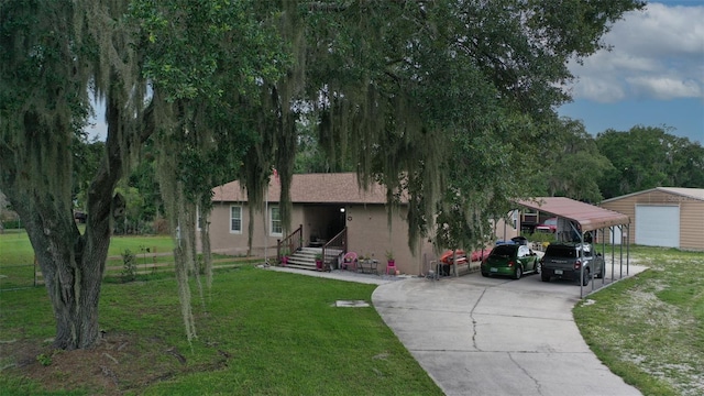 view of front facade with a carport and a front lawn