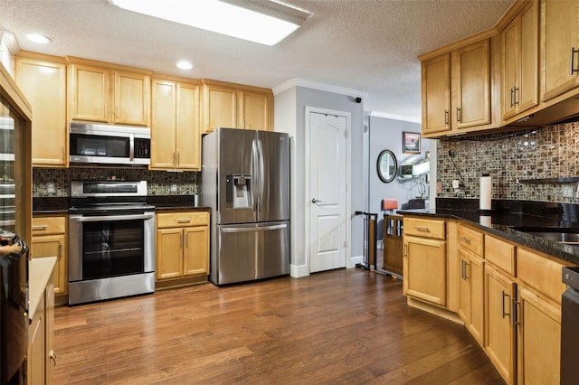 kitchen with backsplash, crown molding, stainless steel appliances, and dark hardwood / wood-style floors