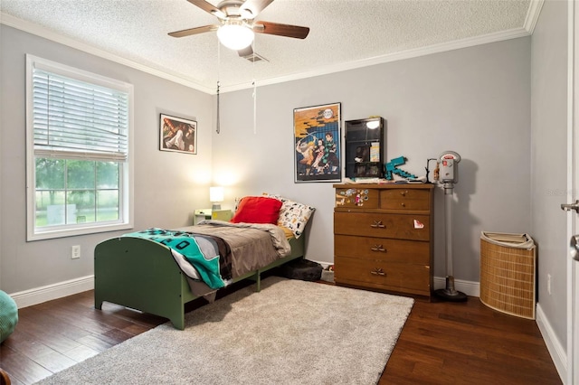 bedroom featuring a textured ceiling, dark hardwood / wood-style flooring, ceiling fan, and ornamental molding