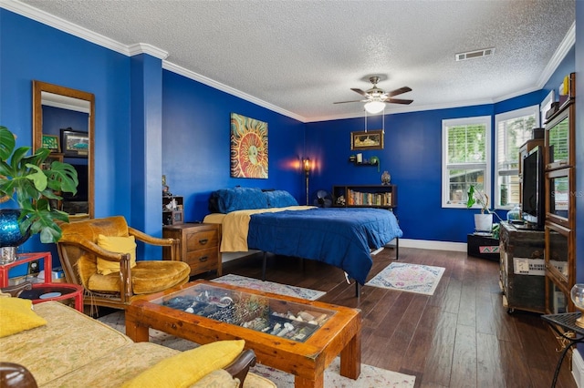 bedroom featuring a textured ceiling, dark hardwood / wood-style floors, ceiling fan, and crown molding