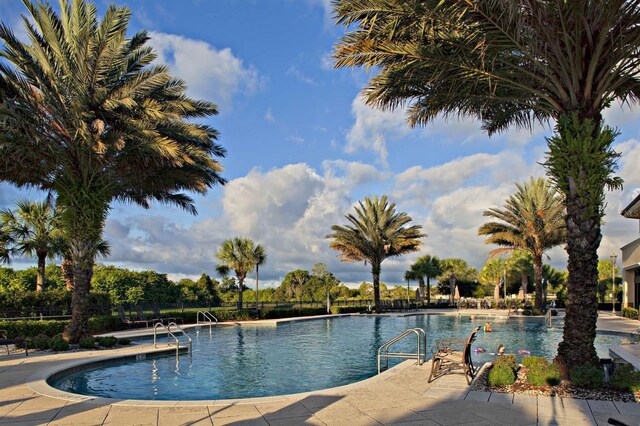 view of swimming pool featuring a patio area