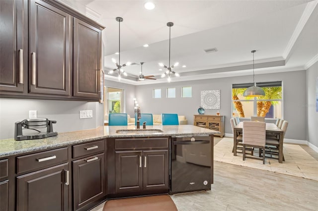 kitchen with pendant lighting, dishwasher, ceiling fan with notable chandelier, a raised ceiling, and sink