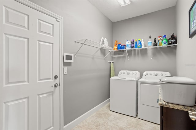 laundry room with separate washer and dryer