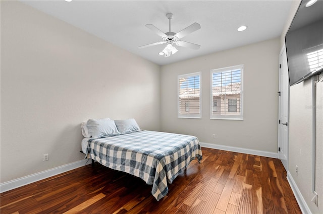 bedroom featuring wood-type flooring and ceiling fan