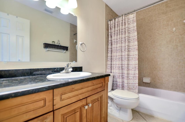 full bathroom with tile patterned flooring, vanity, toilet, and shower / tub combo