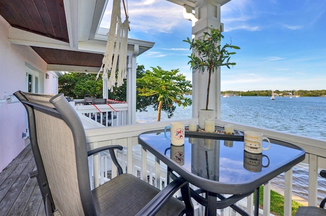 wooden deck with a water view