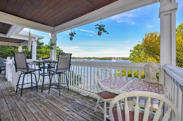 wooden deck with a water view