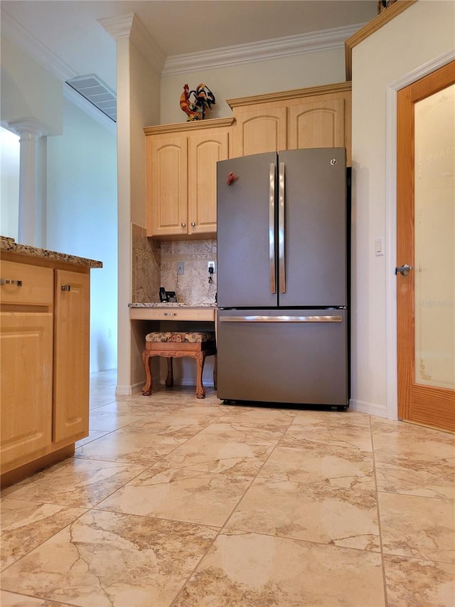 kitchen featuring ornamental molding, light brown cabinetry, decorative backsplash, and stainless steel refrigerator