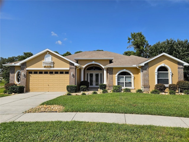 ranch-style home with a front yard and french doors