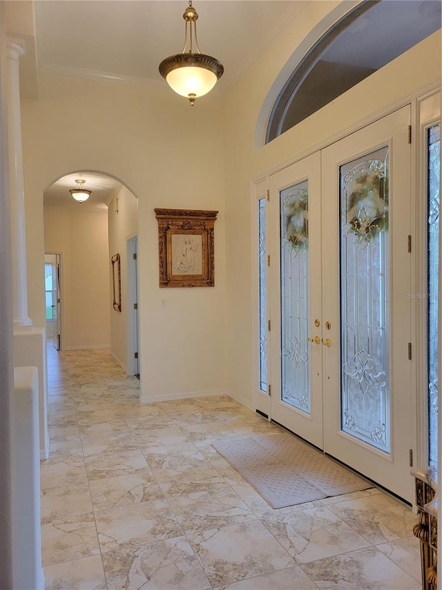 entryway with french doors and crown molding