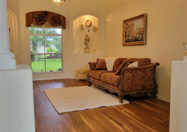 living room with dark hardwood / wood-style flooring