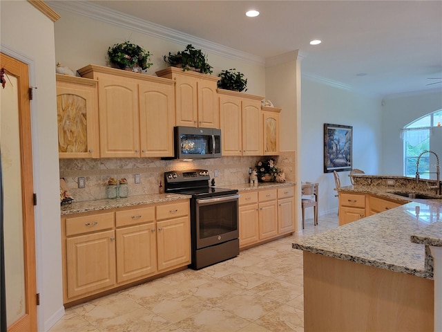 kitchen featuring appliances with stainless steel finishes, light brown cabinets, sink, ornamental molding, and light stone counters