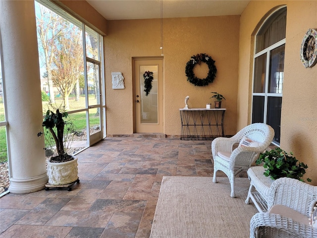 sunroom with decorative columns