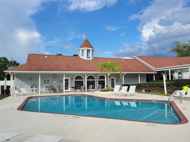 view of swimming pool featuring a patio area