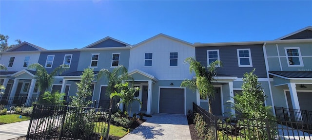 multi unit property featuring a garage