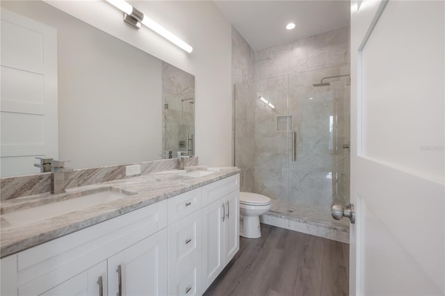 5530 N 9th St Unit 5, Tampa, FL 33604 - full bath featuring a marble finish shower, double vanity, toilet, wood finished floors, and recessed lighting