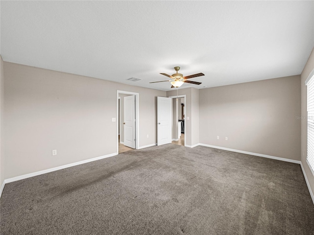 empty room with carpet flooring and ceiling fan