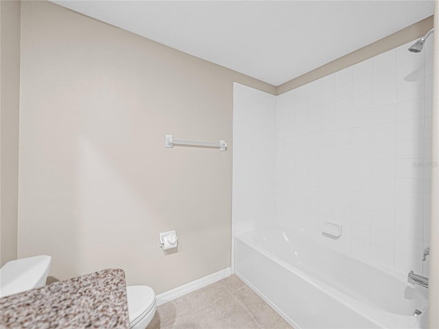 bathroom featuring toilet, tile patterned flooring, and shower / bathing tub combination