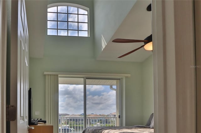 unfurnished bedroom with access to exterior and ceiling fan