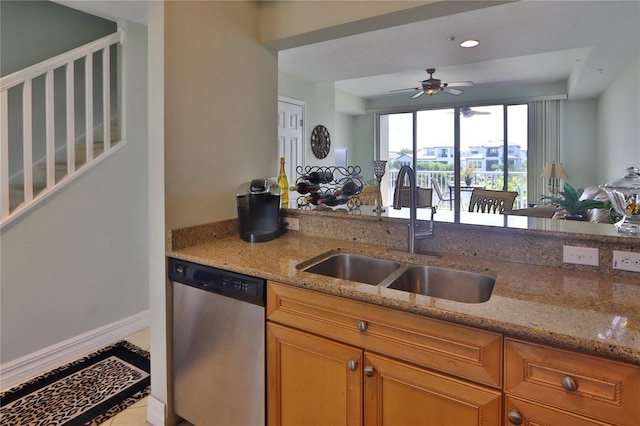kitchen featuring sink, light stone countertops, dishwasher, and ceiling fan