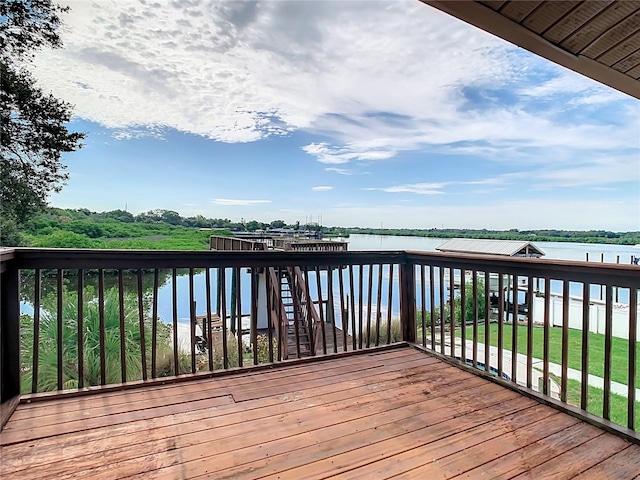 wooden terrace with a water view