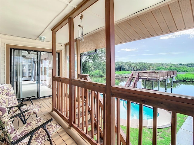 balcony featuring a swimming pool