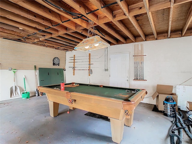 game room with pool table and concrete flooring