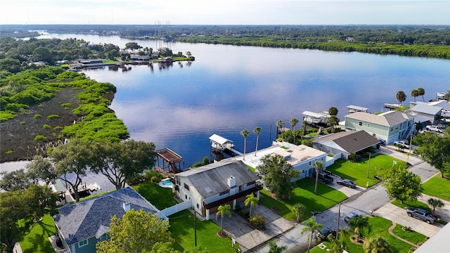 birds eye view of property with a water view