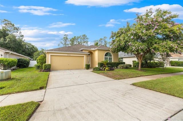 view of front of house featuring a garage and a front yard