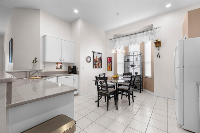 tiled dining room with sink