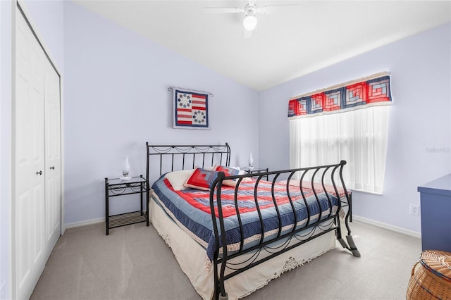 bedroom featuring ceiling fan, carpet, a closet, and lofted ceiling