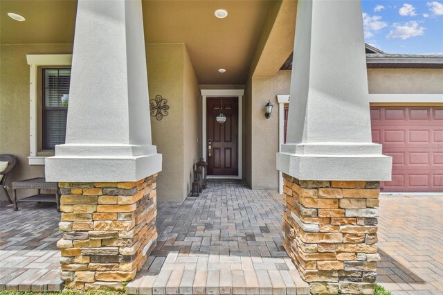 doorway to property with stucco siding