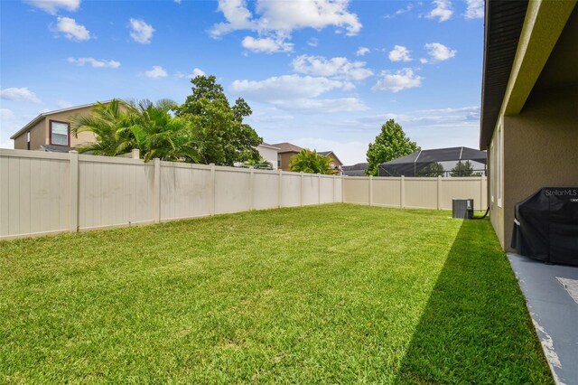 view of yard featuring a fenced backyard and cooling unit