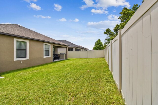 view of yard featuring a fenced backyard