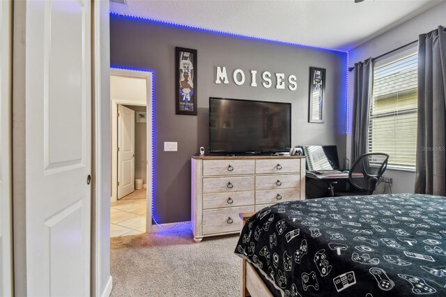 carpeted bedroom with tile patterned floors