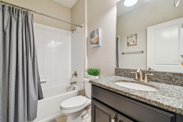 bathroom with vanity, shower / bath combo, and toilet