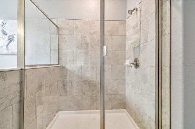 full bath featuring a shower stall