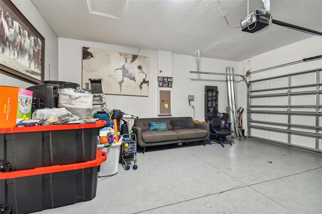 garage featuring a garage door opener and electric panel