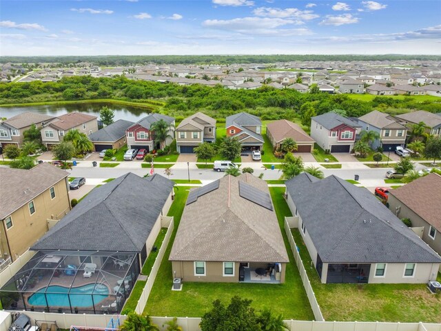 aerial view with a residential view and a water view