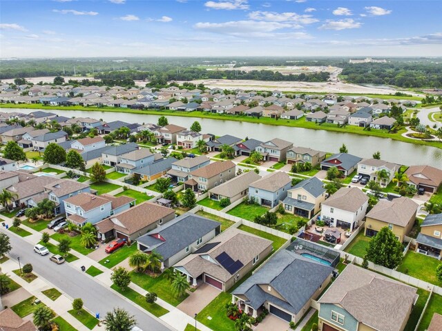 aerial view with a water view and a residential view