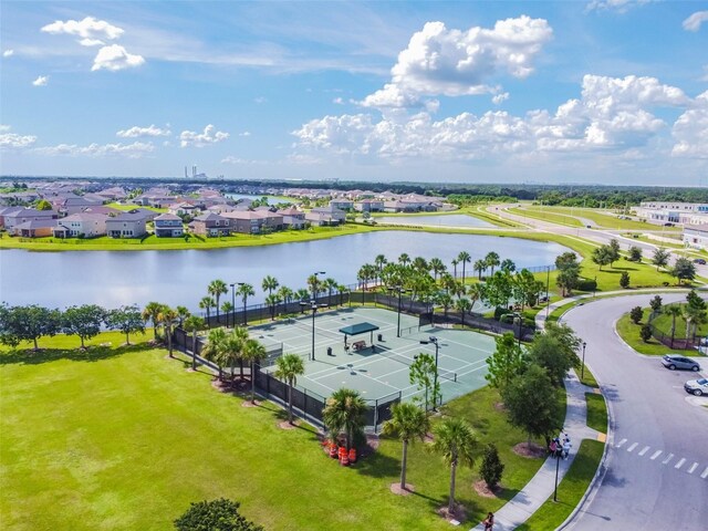 drone / aerial view featuring a water view and a residential view