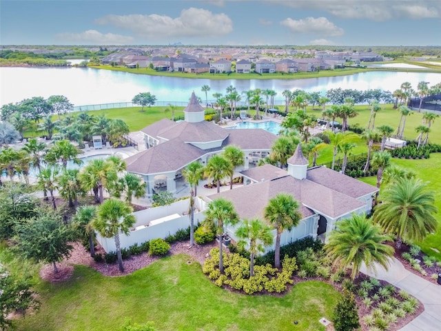 birds eye view of property with a water view and a residential view