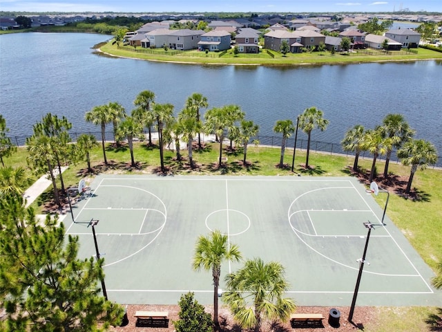 view of basketball court with a water view, community basketball court, and a residential view