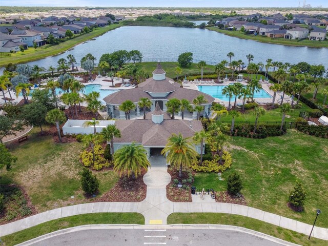 bird's eye view with a water view and a residential view