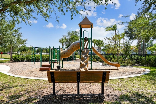 communal playground featuring fence